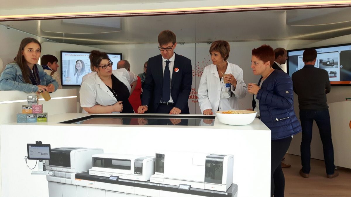 Speaker giving a presentation to guests inside the InfoVan 01