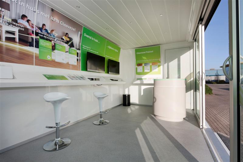 KPN PopUp Shop fully branded in green and white interior