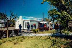 Guests in front of the Huawei Enterprise Europe Roadshow 2023 in France during the event on a beautiful day with in a French courtyard.