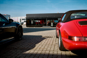 Mobile Showroom and Porsche cars ready for the Roadshow Group Symposium