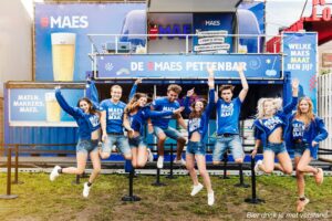 Maes employees jumping in front of the EggStreamer excited for the festival to start!